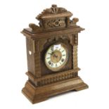 A 20th century oak cased Ansonia mantel clock.