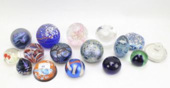 A collection of glass paperweights.