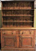 A 20th century pine kitchen dresser.