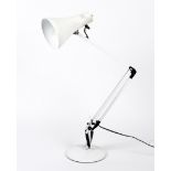 A white anglepoise table lamp.