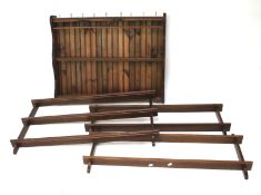 Four wooden reproduction plate racks.