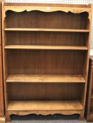 A 20th century stained pine bookshelf.