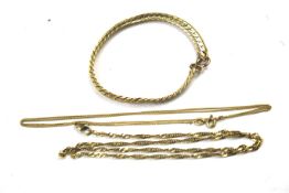 An assortment of yellow metal jewellery. To include an 18ct gold chain, 2.