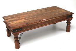 A contemporary hardwood coffee table.