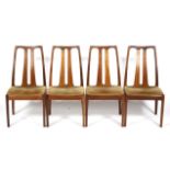 Four Nathan teak dining chairs.