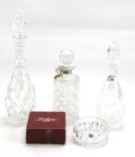 Three 20th century glass decanters and a crystal bowl.