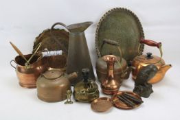 An assortment of brass and other metalware.