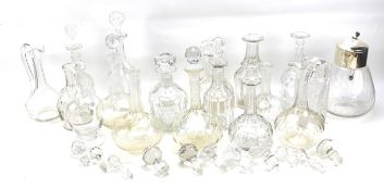 A large collection of glass decanters.