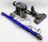 A Dyson DC44 Animal rechargeable vacuum cleaner with plug