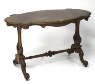 A 19th century veneered occasional table.