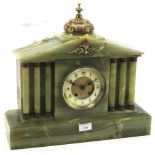 A late 19th century French onyx mantle clock.