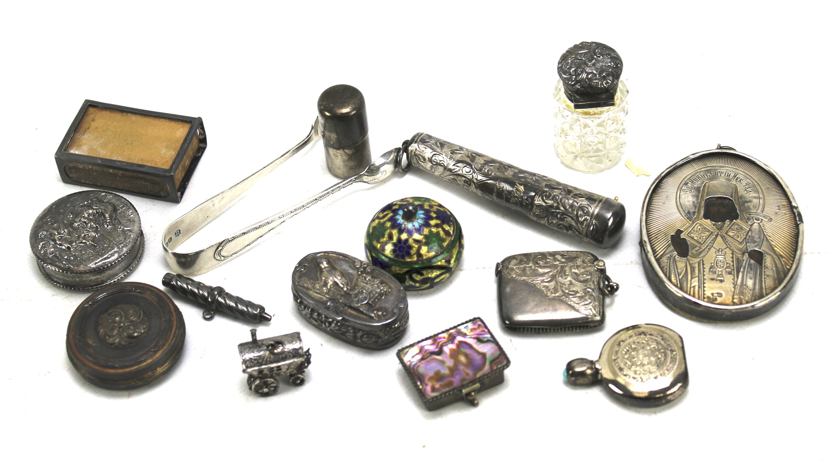 An assortment of small silver and white metal items.