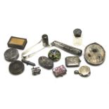 An assortment of small silver and white metal items.