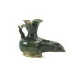 An antique Middle Eastern green glazed pottery vessel. Possibly an oil lamp, 8.