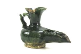 An antique Middle Eastern green glazed pottery vessel. Possibly an oil lamp, 8.