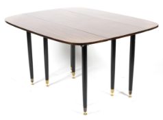 Ernest Gomme for G-Plan Librenza drop-leaf dining table.