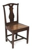A 19th century oak chair. With shaped back and splayed seat, on square tapering supports. H93cm.
