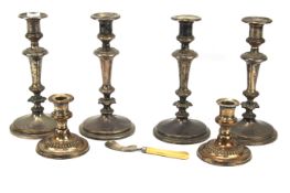 Three sets of silver plated candlesticks and a silver mounted utensil.