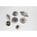 A collection of Celtic design pewter and white metal brooches.