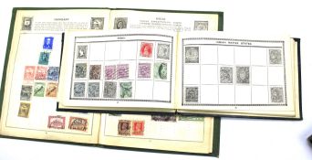 Three early 20th century stamp albums partly mounted with worldwide stamps.