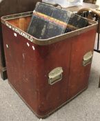 A large wooden storage box and a vintage trunk.