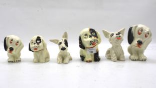 A collection of Crown Devon Bonzo ceramic figures of dogs.