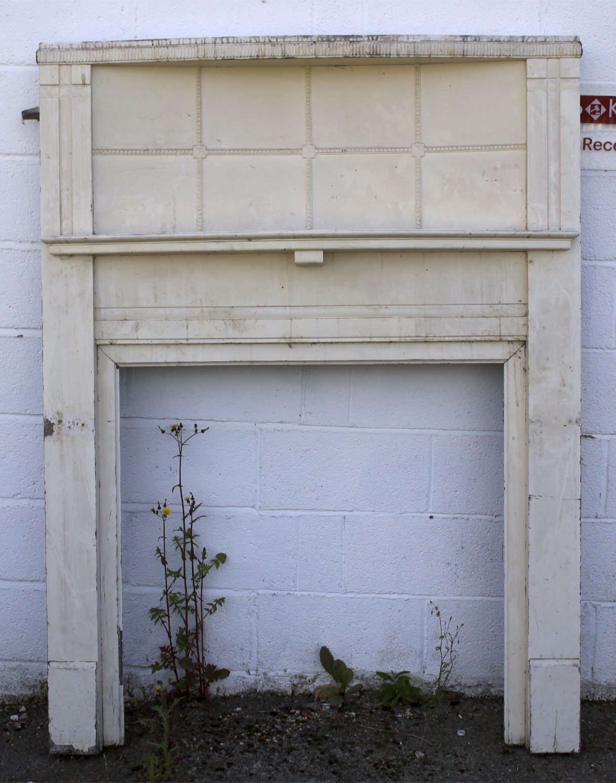 A large white painted fire surround.