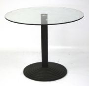 A contemporary glass topped table.