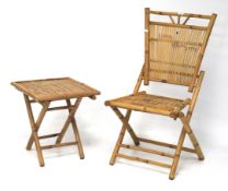 A 20th century bamboo folding chair with matching side table.