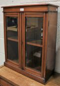 An Edwardian walnut tabletop display cabinet. The glazed doors enclosing a single shelf, L51.