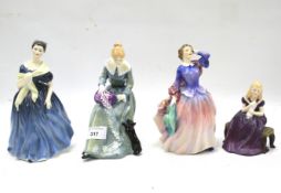 Four Royal Doulton figures of ladies.