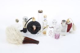 Eleven vintage perfume bottles and a 20th century fan.