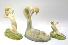 Three 20th century Art Deco Crown Devon figures of nude ladies and a young girl.