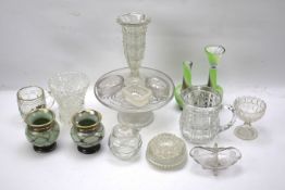 An assortment of glassware and a pair of German vases.