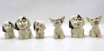 A collection of Crown Devon Bonzo ceramic figures of dogs.