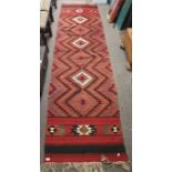 A contemporary Tribal style floor runner.