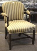 An early 20th century upholstered arm chair.