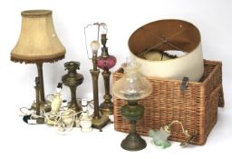 An assortment of Victorian and later oil lamps and lamp bases.