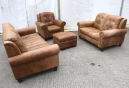 A destressed effect four piece loung suite comprising a Three seater sofa, armchair,