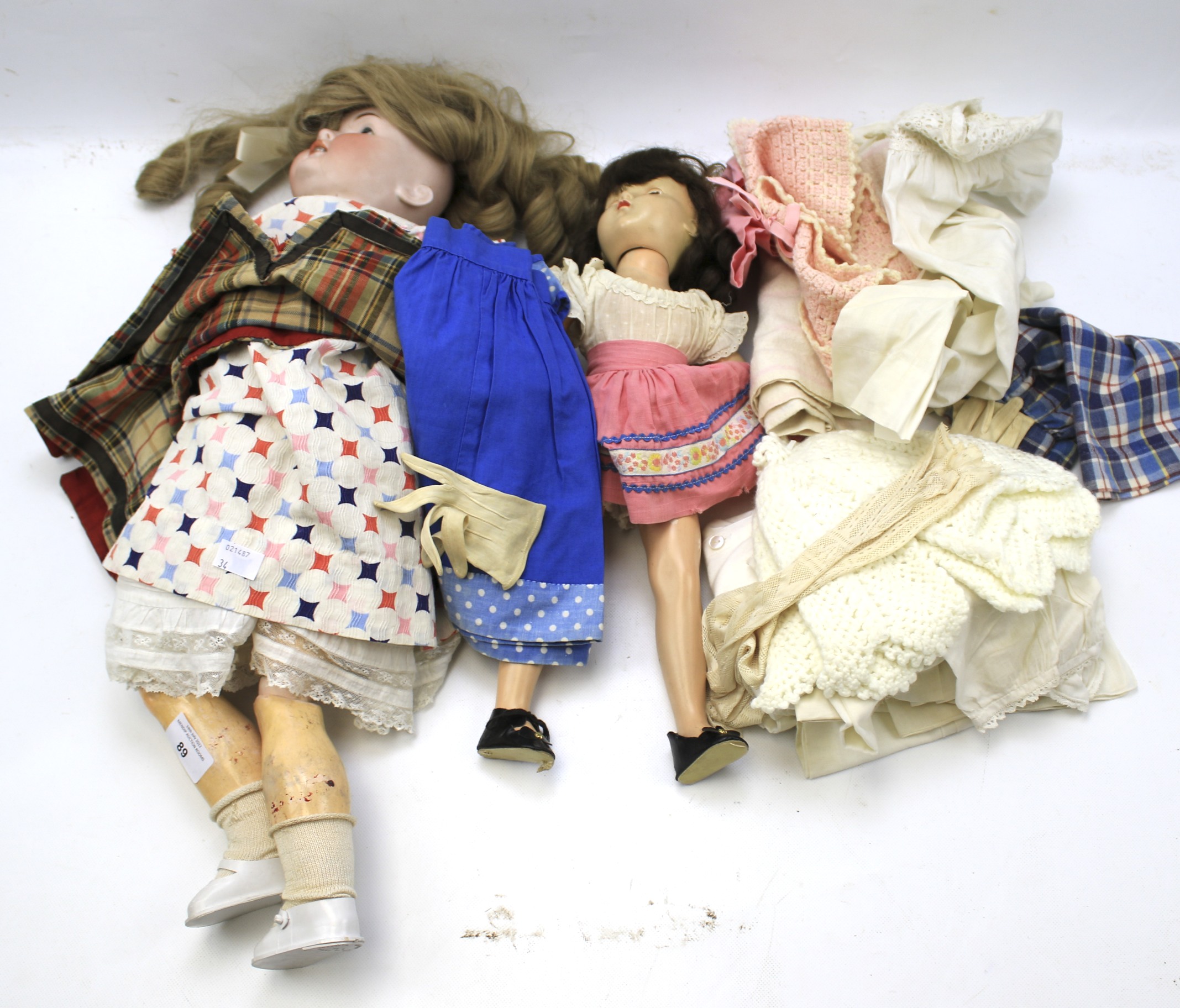 An F & W Goebel doll and one other.