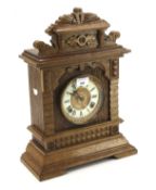 A 20th century oak cased Ansonia mantel clock.