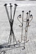 Two garden metal floor standing candelabra.