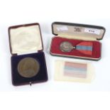 An Elizabeth II faithful service medal and an education medal.