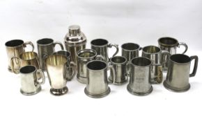 A collection of pewter, chrome and silver plated tankards.