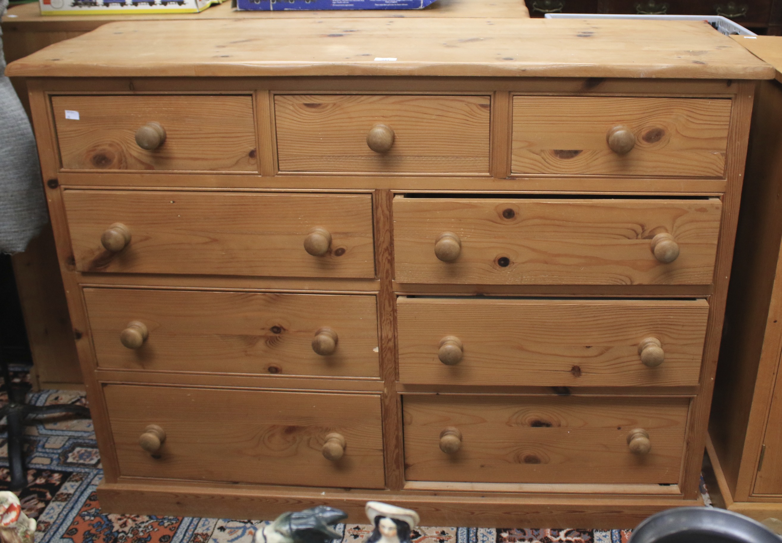 A contemporary large pine chest of drawers.