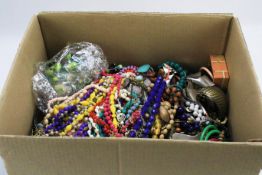 A large box of costume jewellery.