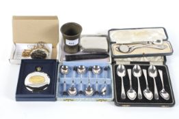 An assortment of silver, silver plate and watches.