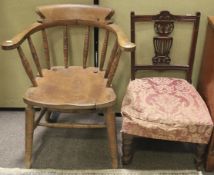 An Edwardian beech smokers tub chair and an Edwardian mahogany upholstered child's lounge chair.