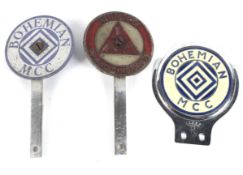 Three enamel car badges.