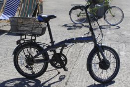 An Apollo transport folding bicycle with mesh basket to rear.